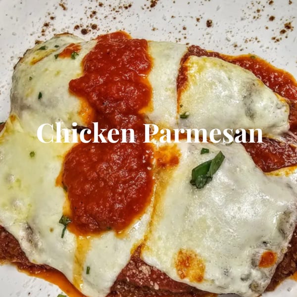 Hartsdale House of Pizza's chicken parmesan, topped with melted mozzarella and rich red sauce.