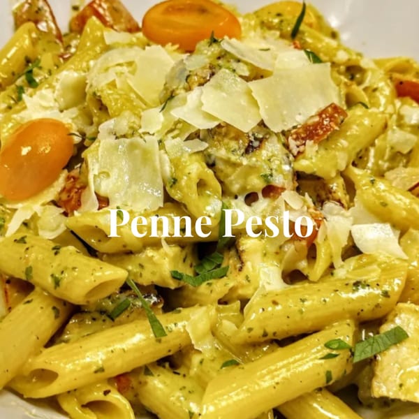 Penne pesto pasta with cherry tomatoes and parmesan cheese, a dish from Hartsdale House of Pizza.